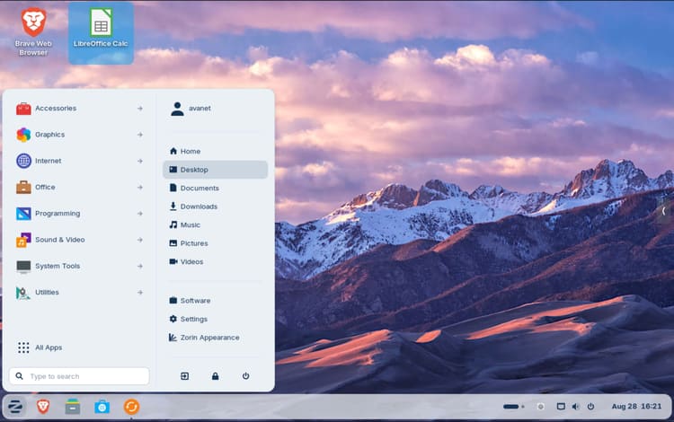খোলা স্টার্ট মেনু এবং Brave এবং LibreOffice Calc এর জন্য শর্টকাট সহ Zorin OS ডেস্কটপ